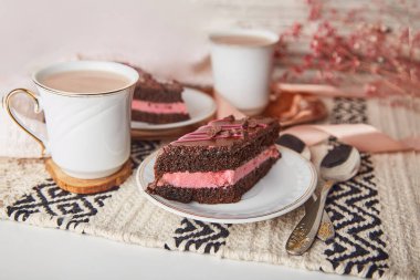 Aesthetics delicate St Valentines day table with chocolate cherry cake pieces, coffee cups among decorations. Pink Valentine s day.