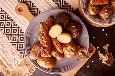 Aesthetics rustic grilled baked vegetables - potatoes, carrots, beetroot. Healthy food. Whole food diet, DASH, Mediterranean diet on natural background