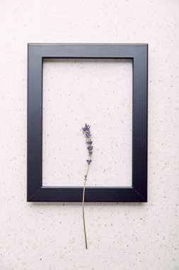 Empty interior black wall frame mockup, template with lavender. Aesthetic minimalist eco-friendly concept background.