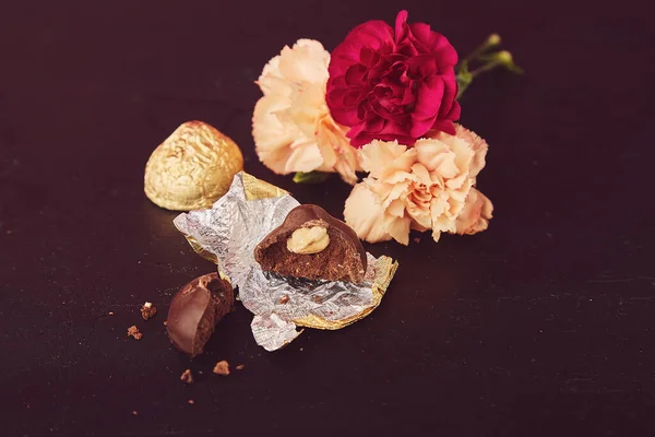 Chocolate bar - nuts candies with flowers aesthetics. Hygge home.