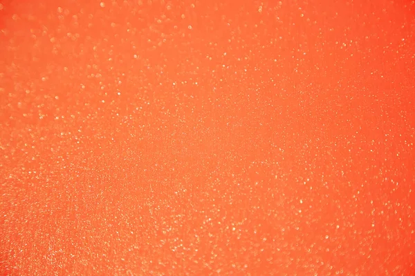 Red orange gradient color background with shining sequins.