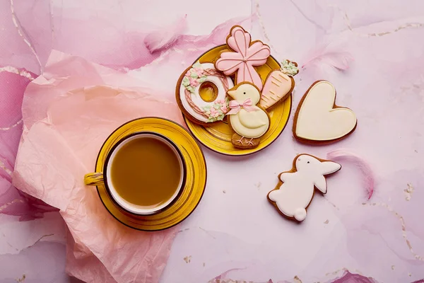 Aesthetics pastel Easter holiday flat lay. Homemade cookies and coffee cup top view. Springtime background.