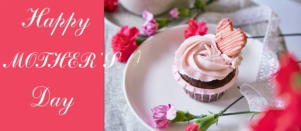 Happy Mothers Day extra wide banner and aesthetic cupcake with pink flowers.