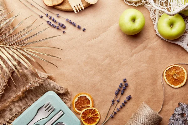 stock image Aesthetic, natural, eco-friendly concept. Eco shopping bag with wooden and paper cutlery, apples, bark tree, lavender. Sustainable, zero waste, plastic free lifestyle on crumpled paper.