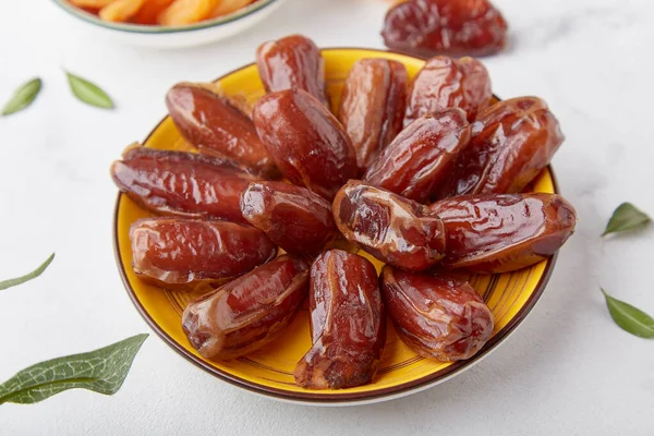 Gluten and sugar free appetizer food, healthy dessert - dates close up.