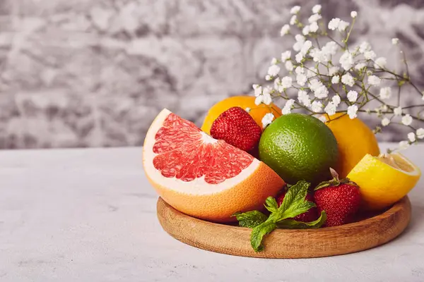 stock image Healthy wooden plate with fresh citrus. Organic, natural vitamins background. Copy space.