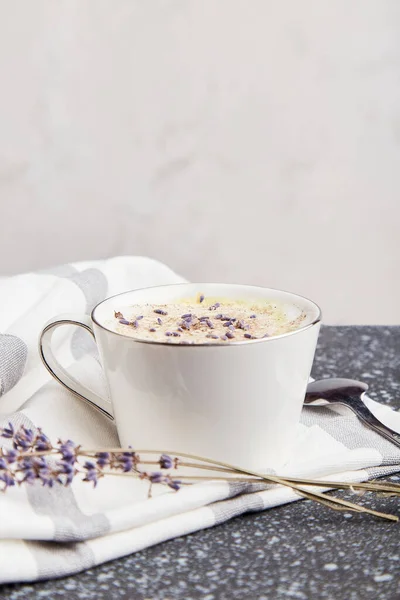 Aesthetic ruf lavender coffee with flowers with copy space.