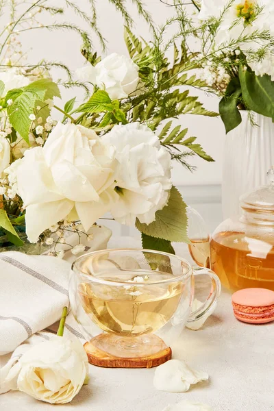 Aesthetic green tea cup, herbal tea in biophilic interior. Natural herbal tea - sustainable eco-friendly lifestyle.