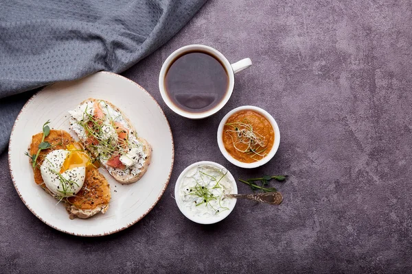 Healthy food - Low-Carb Cuisine sandwiches with zucchini spread and yogurt, egg, salmon, coffee cup. Low in calories, FODMAP, KETO diet, superfood. Copy space.