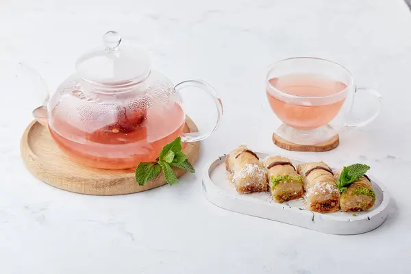 Turkish delight baklava and vitaminized healthy tea with cranberry, mint and sea buckthorn. Aesthetic tea time.