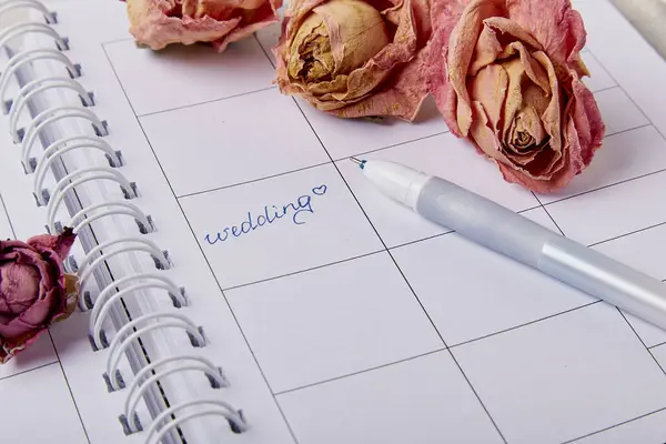 Bridal Dreams - Capturing the Essence of Wedding Preparations - calendar, rings and flowers, wedding checklist.