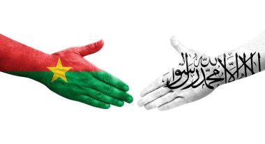 Afganistan ve Burkina Faso bayrakları arasındaki tokalaşma elleri boyalı, izole şeffaf görüntü.