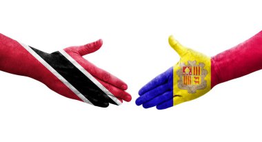 Andorra ve Trinidad Tobago bayrakları arasındaki tokalaşma elleri boyalı, izole şeffaf görüntü.