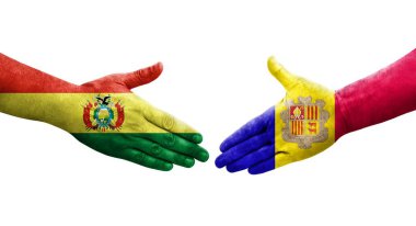 Andorra ve Bolivya bayrakları arasındaki el sıkışma ellerinde, izole şeffaf görüntü.