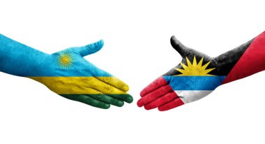 Antigua ve Barbuda ve Ruanda bayrakları arasındaki el sıkışma ellerinde resmedilmiş şeffaf görüntü.