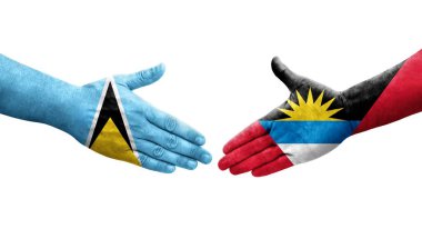 Antigua ve Barbuda ve Saint Lucia bayrakları arasındaki el sıkışma..