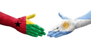 Ellerinde Arjantin ve Gine Bissau bayrakları arasında el sıkışma, izole şeffaf görüntü.