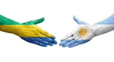 Ellerinde Arjantin ve Gabon bayrakları arasında el sıkışma, izole şeffaf görüntü.