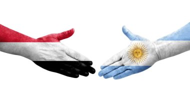 Ellerinde Arjantin ve Yemen bayrakları arasında el sıkışma, izole şeffaf görüntü.