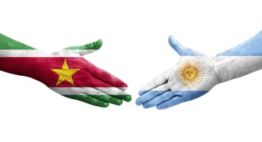 Ellerinde Arjantin ve Surinam bayrakları arasında el sıkışma, izole şeffaf görüntü.