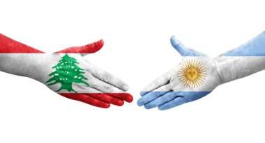 Ellerinde Arjantin ve Lübnan bayrakları arasında el sıkışma, izole şeffaf görüntü.