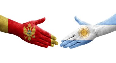 Ellerinde Arjantin ve Karadağ bayrakları arasında el sıkışma, izole şeffaf görüntü.
