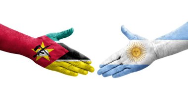 Ellerinde Arjantin ve Mozambik bayrakları arasında el sıkışma, izole şeffaf görüntü.