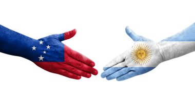 Ellerinde Arjantin ve Samoa bayrakları arasında el sıkışma, izole şeffaf görüntü.