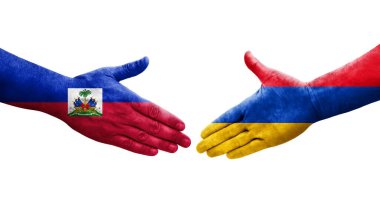 Ellerinde Ermenistan ve Haiti bayrakları arasında el sıkışma, izole şeffaf görüntü.