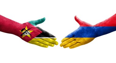 Ellerinde Ermenistan ve Mozambik bayrakları arasında el sıkışma, izole şeffaf görüntü.