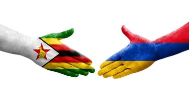 Ellerinde Ermenistan ve Zimbabwe bayrakları arasında el sıkışma, izole şeffaf görüntü.