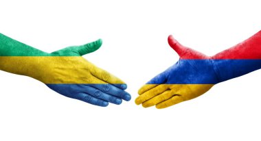 Ellerinde Ermenistan ve Gabon bayrakları arasında el sıkışma, izole şeffaf görüntü.