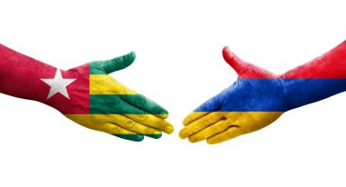 Ellerinde Ermenistan ve Togo bayrakları arasında el sıkışma, izole şeffaf görüntü.