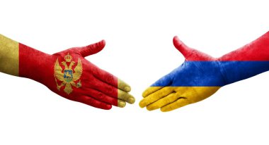 Ellerinde Ermenistan ve Karadağ bayrakları arasında el sıkışma, izole şeffaf görüntü.
