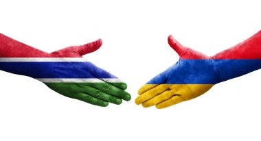 Ellerinde Ermenistan ve Gambiya bayrakları arasında el sıkışma, izole şeffaf görüntü.