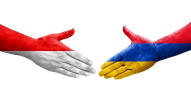 Ellerinde Ermenistan ve Endonezya bayrakları arasında el sıkışma, izole şeffaf görüntü.
