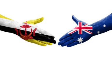 Ellere boyanmış Avustralya ve Brunei bayrakları arasındaki el sıkışma, izole şeffaf görüntü.