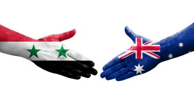 Ellerinde Avustralya ve Suriye bayrakları arasında el sıkışma, izole şeffaf görüntü.