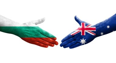 Avustralya ile Bulgaristan arasındaki el sıkışma ellerinde boyalı bayraklar, izole şeffaf görüntü.