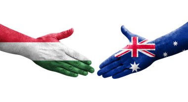 Ellerinde Avustralya ve Macaristan bayrakları arasında el sıkışma, izole şeffaf görüntü.
