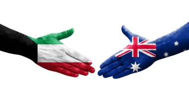 Avusturalya ve Kuveyt bayrakları arasındaki el sıkışma ellere boyanmış, izole saydam görüntü.