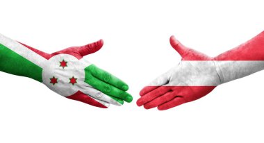 Ellerinde Avusturya ve Burundi bayrakları arasında el sıkışma, izole şeffaf görüntü.