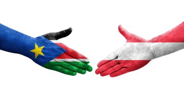 Ellerinde Avusturya ve Güney Sudan bayrakları arasında el sıkışma, izole şeffaf görüntü.