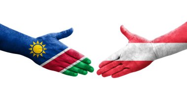 Ellerinde Avusturya ve Namibya bayrakları arasında el sıkışma, izole şeffaf görüntü.