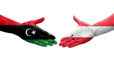 Ellerinde Avusturya ve Libya bayrakları arasında el sıkışma, izole edilmiş şeffaf görüntü.