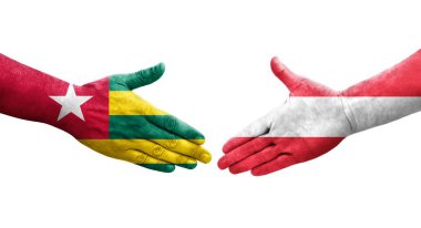 Ellerinde Avusturya ve Togo bayrakları arasında el sıkışma, izole şeffaf görüntü.