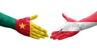 Avusturya ve Kamerun bayrakları arasındaki el sıkışma, izole edilmiş şeffaf görüntü.