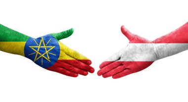 Avusturya ve Etiyopya bayrakları arasındaki el sıkışma ellere boyanmış, izole şeffaf görüntü.