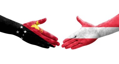 Avusturya ile Papua Yeni Gine bayrakları arasındaki el sıkışma, izole şeffaf görüntü.