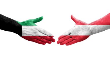 Avusturya ve Kuveyt bayrakları arasındaki tokalaşma elleri boyalı, izole şeffaf görüntü.
